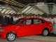 SetWidth600 Mr Joerg Mueller centre Mr K K Swamy right and Dr John Chacko left along with the employees during the Start of Production of the Volkswagen Vento e1280917866916