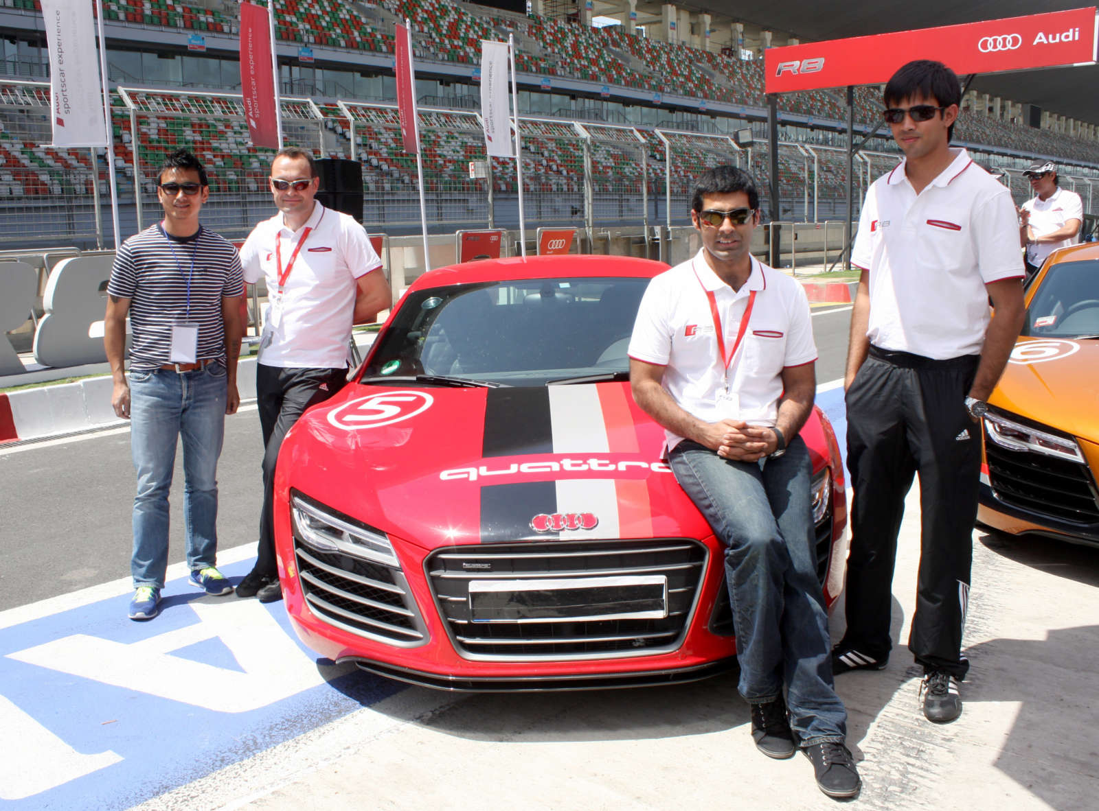 From Left to Right - Indian Football Icon, Baichung Bhutia, Michael Perschke, Head, Audi India, Ace Drivers Karun Chandhok and Aditya Patel at the launch of Audi R8 V10 Plus at BIC-1