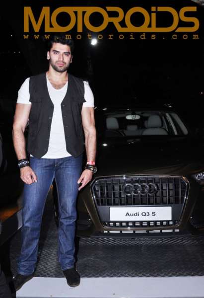 Actor, Niketan Dheer posing with the Audi Q3 S Edition at the Audi Autumn Collection showcasing in Mumbai