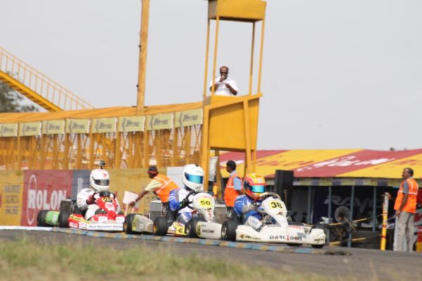 Kush Maini leads Krishnaraaj Mahadik in Junior Max Heats of the JK Tyre-FMSCI National Rotax Max Karting Championship 2013 Round 3 in Coimbatore on Saturday