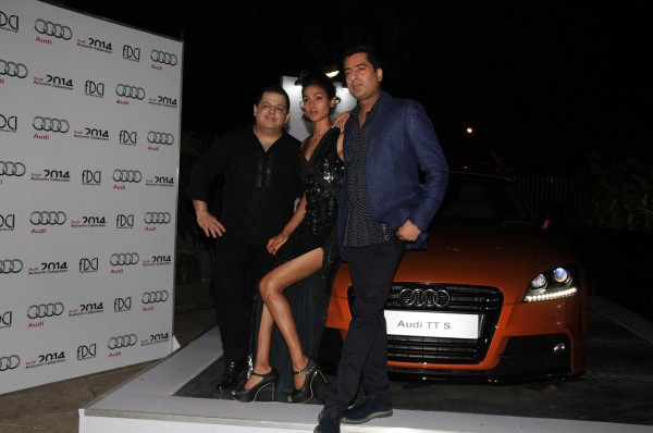 L-R-Designer duo, Rohit Gandhi & Rahul Khanna with model, Nethra Raghuraman posing with the Audi TT