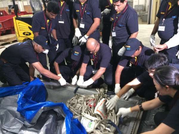 DHL Disaster Response Team members putting their knowledge on warehouse and ramp operations to practice during the training in Bangalore