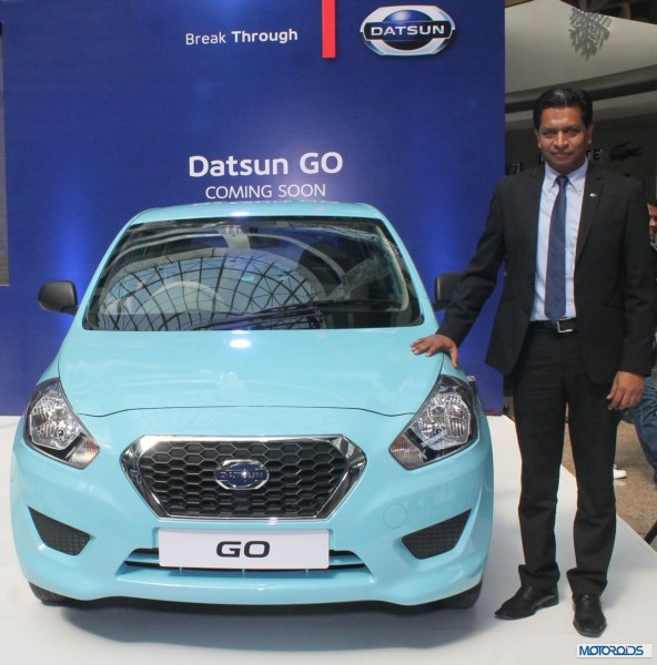 Pic 1 - Mr. John Kullu along with the Datsun Go