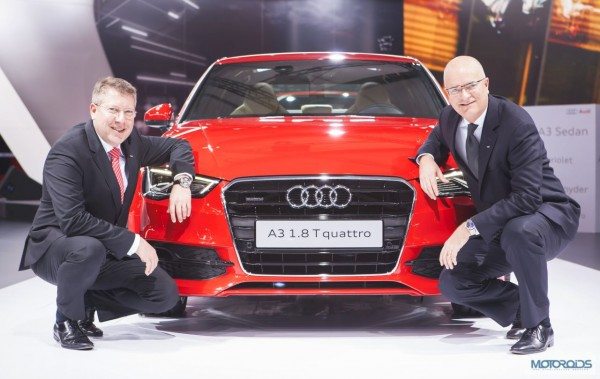 Mr. Terence Johnsson, Vice-President, Overseas Sales of AUDI AG (Sitting in Right - Blue Tie) and Mr. Joe King, Head, Audi India (Sitting in Left - Red Tie) with the Audi A3 Sedan at Auto Expo 2014