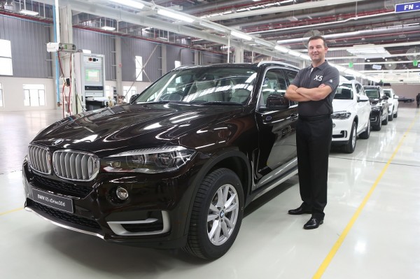 Robert Frittrang, Managing Director, BMW Plant Chennai with the all-new BMW X5 as it rolls out of BMW Plant Chennai.