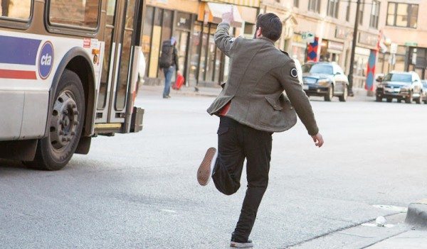 man running to catch a bus