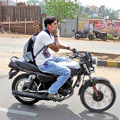 Mobile phone usage while driving / riding: