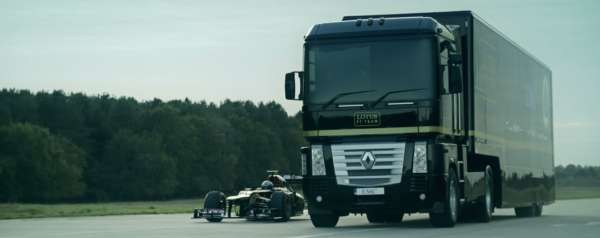 Sem-Truck jumping over speeding F1 car