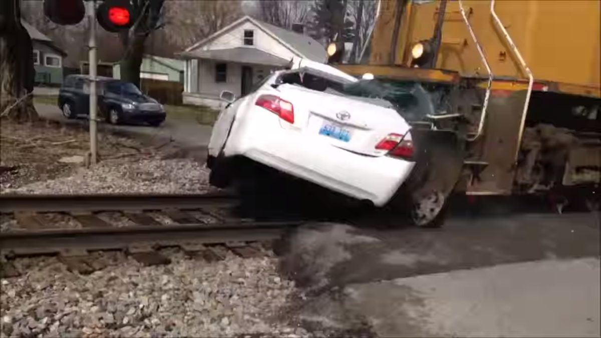 Train crashes into Camry