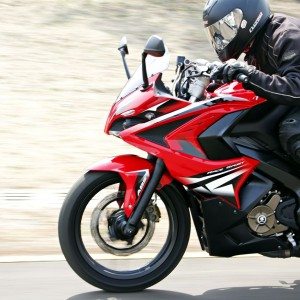 Bajaj Pulsar RS riding left side