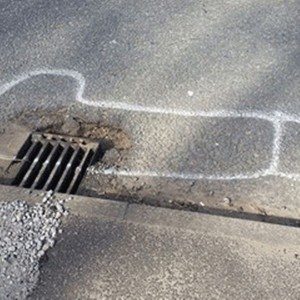 wanksy artist pothole graffiti