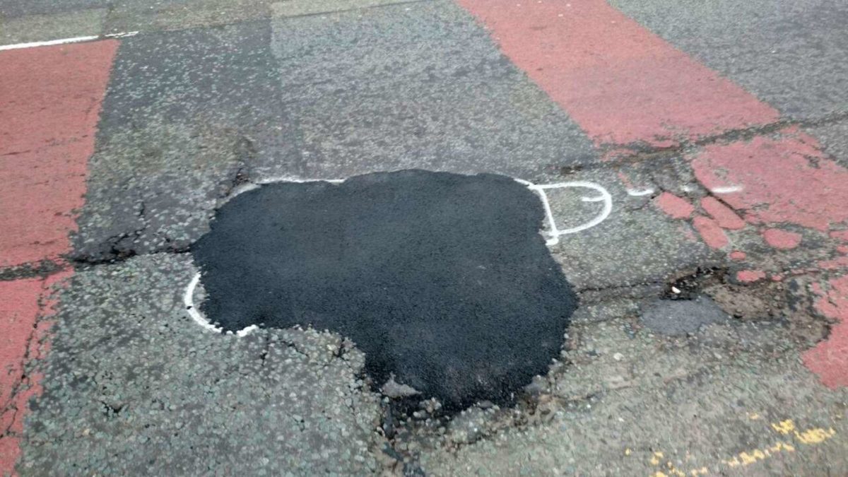 wanksy artist pothole graffiti