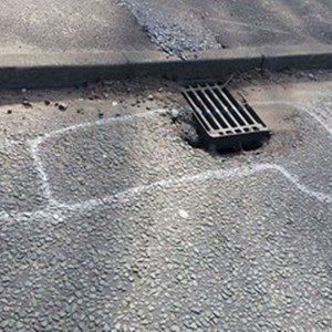 wanksy artist pothole graffiti