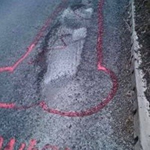 wanksy artist pothole graffiti