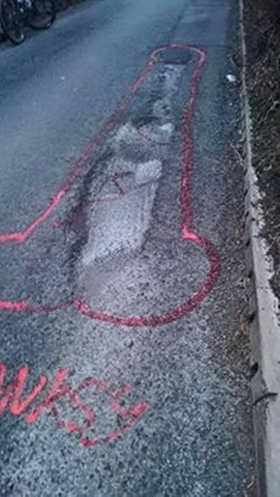 wanksy artist pothole graffiti (5)