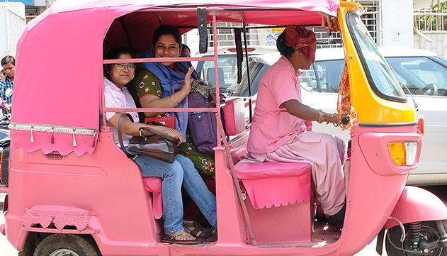 Pink auto ferrying woam passenger