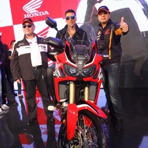 Akshay Kumar poses on the Africa Twin motorcycle at Honda Wheelers pavilion at Autp Expo