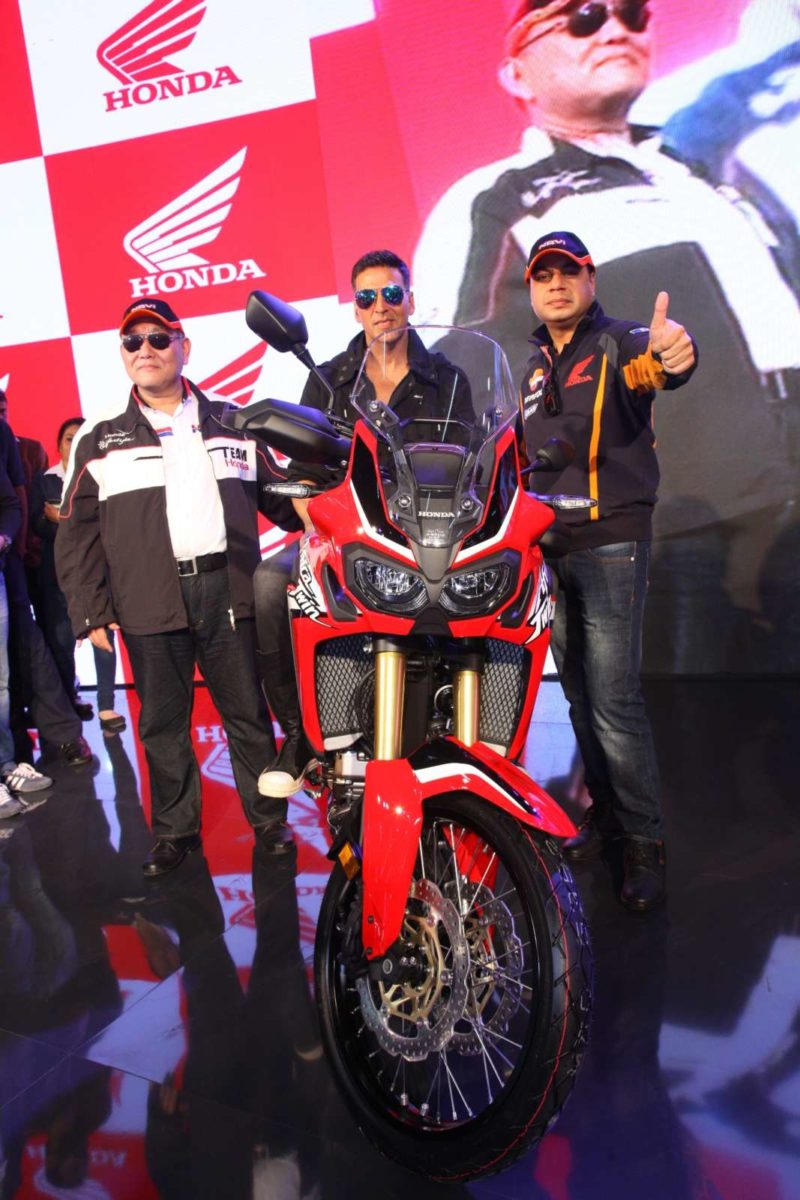 Akshay Kumar poses on the Africa Twin motorcycle at Honda Wheelers pavilion at Autp Expo