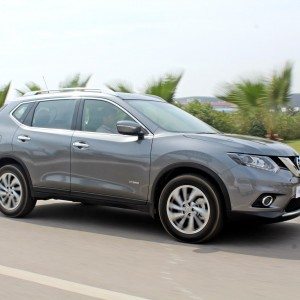 new  Nissan X Trail Hybrid India grey action