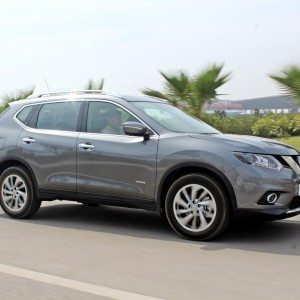 new  Nissan X Trail Hybrid India grey action