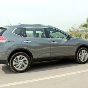 new  Nissan X Trail Hybrid India grey action