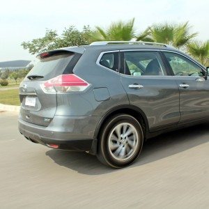 new  Nissan X Trail Hybrid India grey action rear