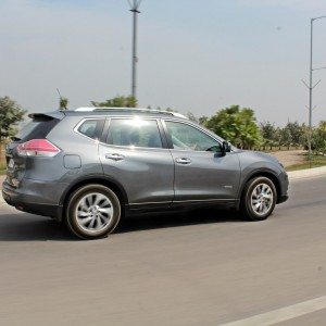 new  Nissan X Trail Hybrid India grey action rear