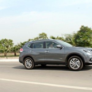 new  Nissan X Trail Hybrid India grey action rear