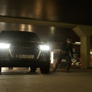 Captain America Chris Evans besides an Audi SQ
