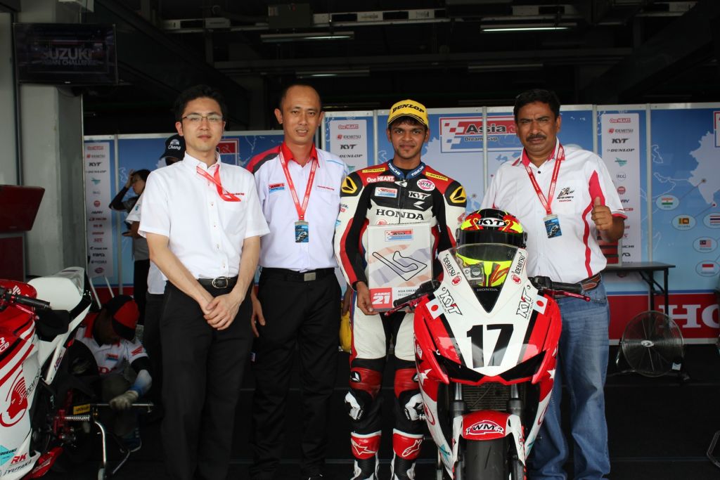 The man with his winning Machine and Honda team