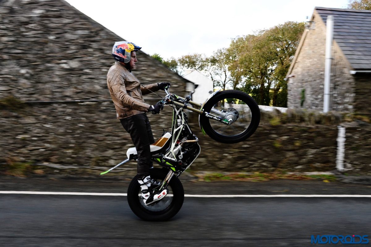 Dougie Lampkin wheelies across the Isle of Man TT course
