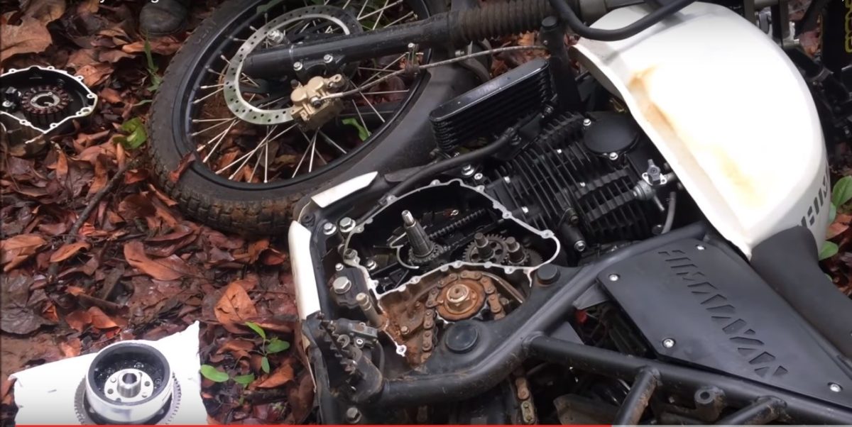 RE Himalayan Engine Mended Using a Registration Plate in The Middle of a Jungle