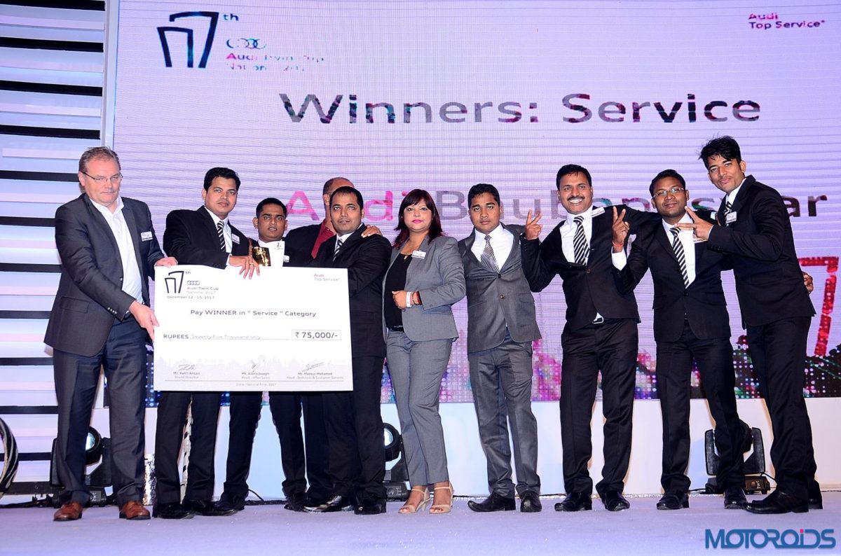 Audi Bhubaneshwar winner in Service Category receiving the Audi Twin Cup trophy at the Seventh edition of the national Audi Twin Cup