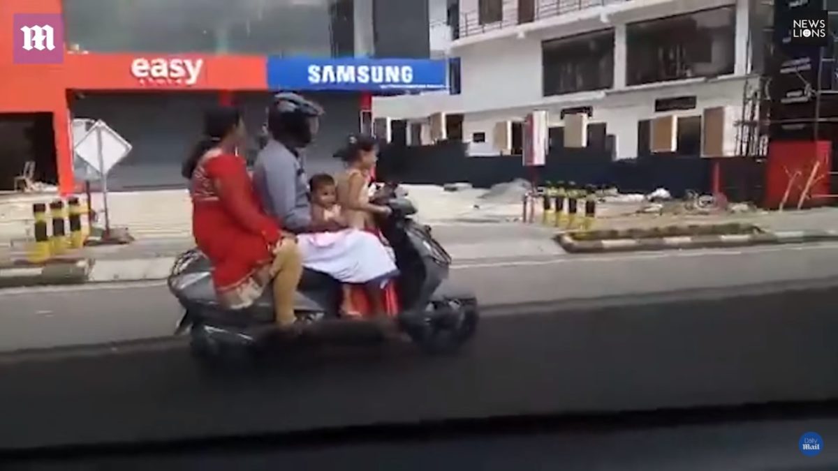 Five Year Old Rides Scooter With Family On Board Feature Image