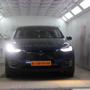 Tesla model X front in booth