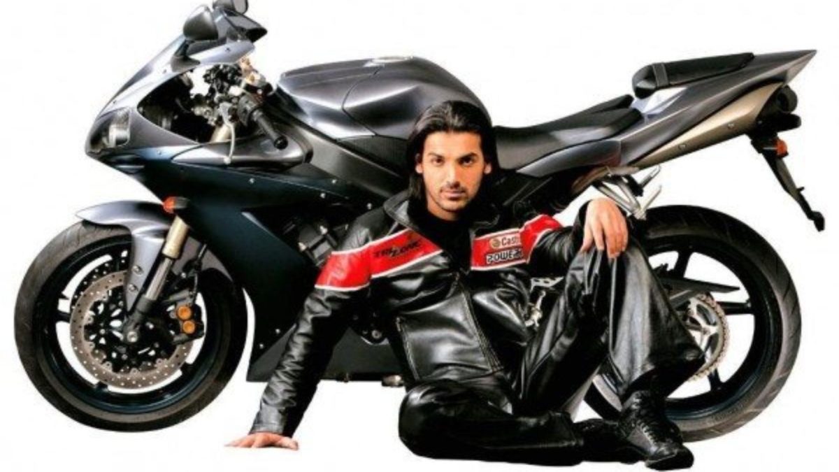 John Abraham posing with a motorcycle