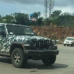 Jeep Wrangler Next gen spied side quarter green three door