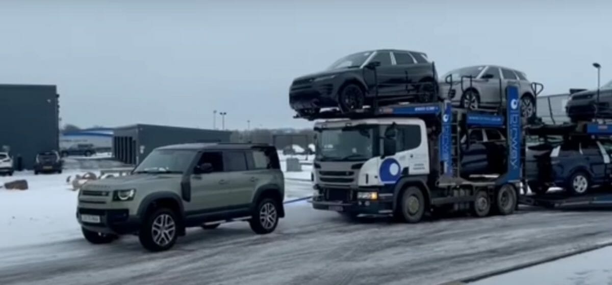 Land rover defender pulls a truck