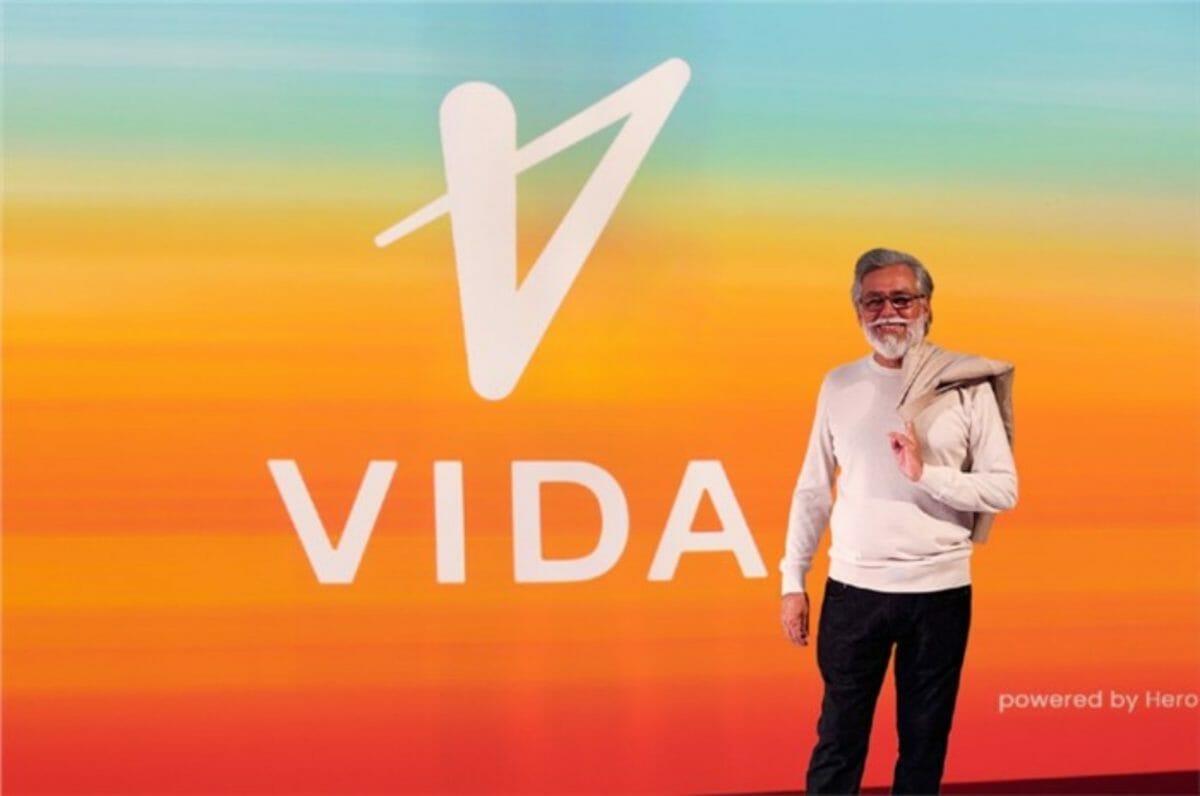 Pawan Munjal Chairman and CEO at Hero MotoCorpStanding next to the brand name Vida